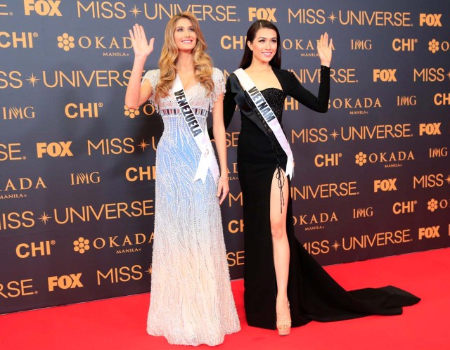 Miss Universe candidates Mariam Habach of Venezuela and Dang Thi Le Hang of Vietnam pose for a picture during a red carpet inside a SMX convention in metro Manila, Philippines January 29, 2017. REUTERS/Romeo Ranoco
