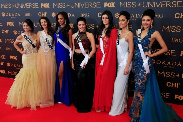 Miss Universe candidates pose for a picture during a red carpet inside a SMX convention in metro Manila, Philippines January 29, 2017. In Photo from L-R: Miss New Zealand Zoey Ivory, Miss Hungary Veronika Bodizs, Miss Curacao Chanelle de Lau, Miss Malta Martha Fenech, Miss Italy Sophia Sergio, Miss Kosovo Camila Barraza and Miss Mexico Kristal Silva. REUTERS/Romeo Ranoco
