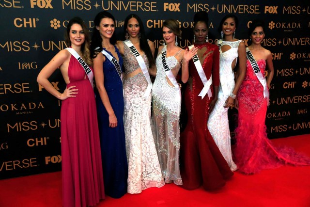 Miss Universe candidates pose for a picture during a red carpet inside a SMX convention in metro Manila, Philippines January 29, 2017. In Photo from L-R: Miss Israel Yam Kaspers Anshel, Miss Namibia Lizelle Esterhuizen, Miss Haiti Raquel Pelissier, Miss Germany Johanna Acs, Miss Kenya Mary Esther Were, Miss Jamaica Isabel Dalley and Miss Mauritius Kushboo Ramnawaj. REUTERS/Romeo Ranoco