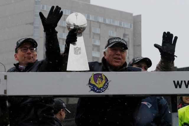 New England Patriots owner Bob Kraft holds one of the team's five Vince Lombardi trophies during their victory parade through the streets of Boston after winning Super Bowl LI, in Boston
