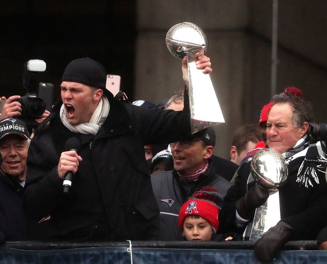 New England Patriots quarterback Tom Brady, New England Patriots head coach Bill Belichick, hoist the Lombardi Championship trophiesduring Super Bowl LI victory parade in Boston