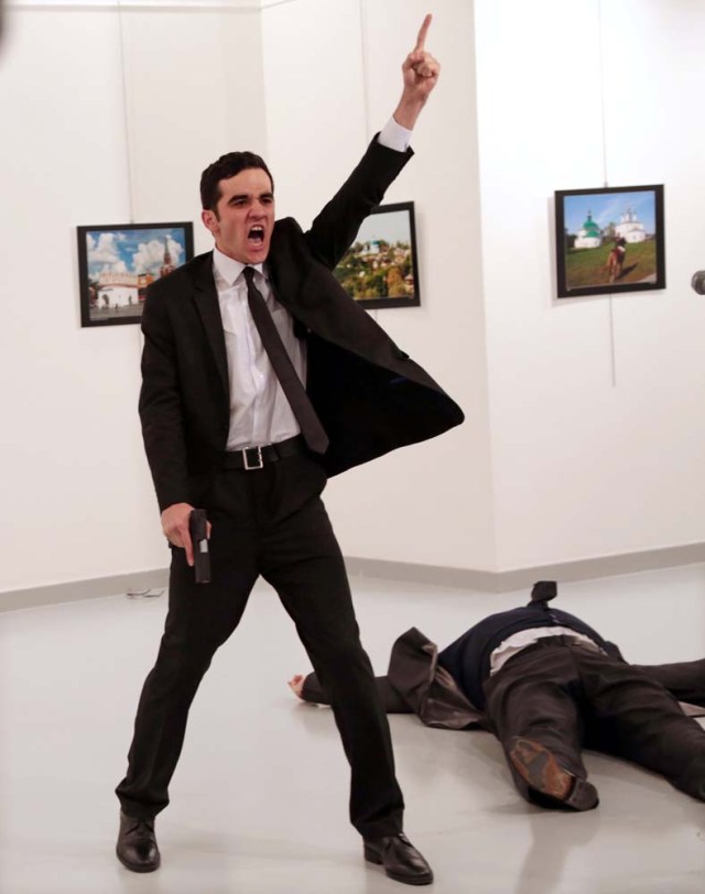 Mevlut Mert Altintas shouts after shooting Andrei Karlov the Russian ambassador to Turkey, at an art gallery in Ankara, Turkey December 19, 2016. Burhan Ozbilici, The Associated Press/Courtesy of World Press Photo Foundation/Handout via REUTERS THIS IMAGE HAS BEEN SUPPLIED BY A THIRD PARTY. FOR EDITORIAL USE ON WORLD PRESS PHOTO ONLY. NO RESALES. NO CROPPING. TURKEY OUT. NO COMMERCIAL OR EDITORIAL SALES IN TURKEY
