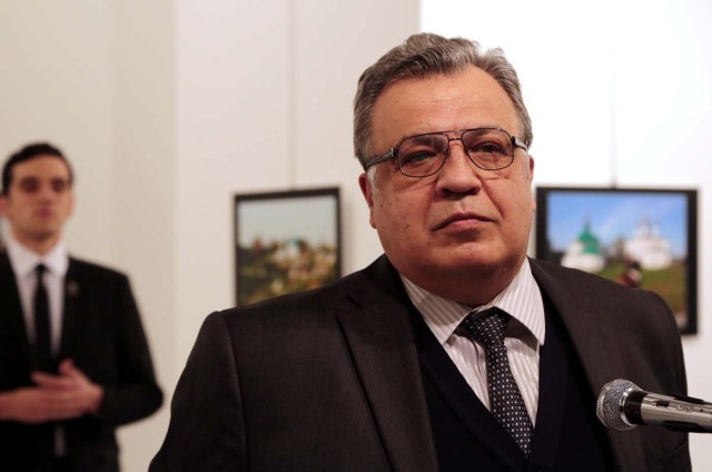 Andrei Karlov, the Russian ambassador to Turkey, speaks at an art gallery before being shot by Mevlut Mert Altintas, left, in Ankara, Turkey, Monday, Dec. 19, 2016. Burhan Ozbilici, The Associated, Panos Pictures/Courtesy of World Press Photo Foundation/Handout via REUTERS THIS IMAGE HAS BEEN SUPPLIED BY A THIRD PARTY. FOR EDITORIAL USE ON WORLD PRESS PHOTO ONLY. NO RESALES. NO CROPPING