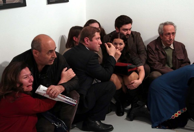 Gallery goers cower after Mevlut Mert Altintas shot Andrei Karlov, the Russian ambassador to Turkey, at an art gallery in Ankara, Turkey, Monday, Dec. 19, 2016. Burhan Ozbilici, The Associated, Panos Pictures/Courtesy of World Press Photo Foundation/Handout via REUTERS THIS IMAGE HAS BEEN SUPPLIED BY A THIRD PARTY. FOR EDITORIAL USE ON WORLD PRESS PHOTO ONLY. NO RESALES. NO CROPPING