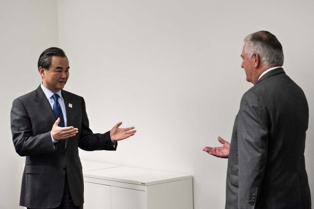 US Secretary of State Rex Tillerson (R) is greeted by China's Foreign Minister Wang Yi before a meeting on the sidelines of a gathering of Foreign Ministers of the G20 leading and developing economies at the World Conference Center in Bonn, western Germany, February 17, 2017. REUTERS/Brendan Smialowski/Pool