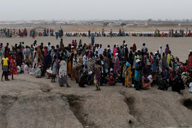 People wait to receive food inside the United Nations Mission in South Sudan (UNMISS) Protection of Civilians site (PoC), near Bentiu, northern South Sudan, February 10, 2017. Picture taken February 10, 2017. REUTERS/Siegfried Modola