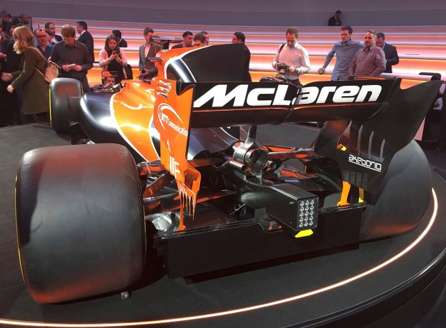 Journalists use their mobile phones to photograph McLaren's new MCL32 Formula One car at its launch in Woking, Britain, February 24, 2017. REUTER/Alan Baldwin