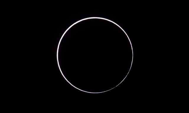 Picture taken on February 26, 2017 showing an annular solar eclipse, as seen from the Estancia El Muster, near Sarmiento, Chubut province, 1600 km south of Buenos Aires, Argentina, on February 26, 2017. Stargazers applauded as they were plunged into darkness Sunday when the moon passed in front of the sun in a spectacular "ring of fire" eclipse. / AFP PHOTO / ALEJANDRO PAGNI