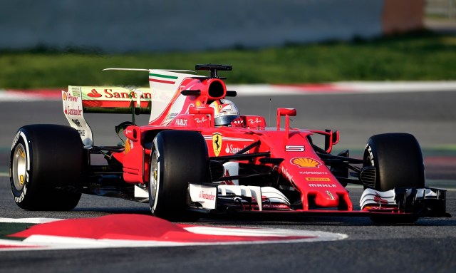 Ferrari's German driver Sebastian Vettel drives at the Circuit de Catalunya on February 27, 2017 in Montmelo on the outskirts of Barcelona during the first day of the first week of tests for the Formula One Grand Prix season.  / AFP PHOTO / JOSE JORDAN