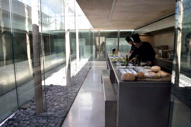 A picture taken in Olot on March 2, 2017 shows chefs in the kitchen of the restaurant "les Cols" designed by RCR architects, formed by Spanish architects, Rafael Aranda, Carme Pigem and Ramon Vialta who won yesterday the prestigious Pritzker Prize for modern works. The choice was seen as a move away from the celebrity architects that have dominated the field in favour of the homegrown vision of a trio of professionals who have worked together for 30 years in their hometown of Olot in Catalonia. / AFP PHOTO / LLUIS GENE
