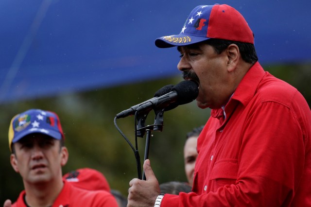 Venezuela's President Nicolas Maduro (R) speaks during a pro-government rally, next to Venezuela's Vice President Tareck El Aissami, in Caracas, Venezuela March 9, 2017. REUTERS/Marco Bello