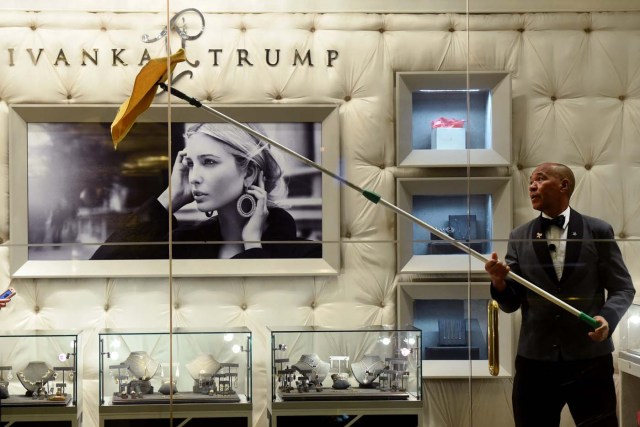 (FILES) This file photo taken on January 17, 2017 shows a worker cleaning the windows of the Ivanka Trump Boutique at Trump Tower in New York. In his January inauguration speech, US President Donald Trump made a seemingly straightforward pledge: "We will follow two simple rules: buy American and hire American." His daughter is the exception: even as he spoke, at least eight shipments of Ivanka Trump-branded shoes, bags and clothes -- more than 53.5 tonnes -- were steaming towards American ports from China, according to US Customs bills of lading examined by AFP. / AFP PHOTO / Timothy A. CLARY / TO GO WITH China-US-politics-economy-trade-Trump, FOCUS by Ben DOOLEY