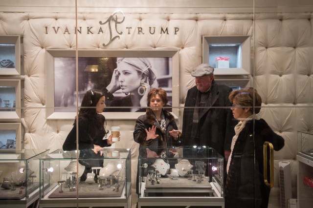 (FILES) This file photo taken on December 11, 2016 shows a woman looking over rings for sale at the Ivanka Trump store in Trump Tower in New York. In his January inauguration speech, US President Donald Trump made a seemingly straightforward pledge: "We will follow two simple rules: buy American and hire American." His daughter is the exception: even as he spoke, at least eight shipments of Ivanka Trump-branded shoes, bags and clothes -- more than 53.5 tonnes -- were steaming towards American ports from China, according to US Customs bills of lading examined by AFP. / AFP PHOTO / BRYAN R. SMITH / TO GO WITH China-US-politics-economy-trade-Trump, FOCUS by Ben DOOLEY