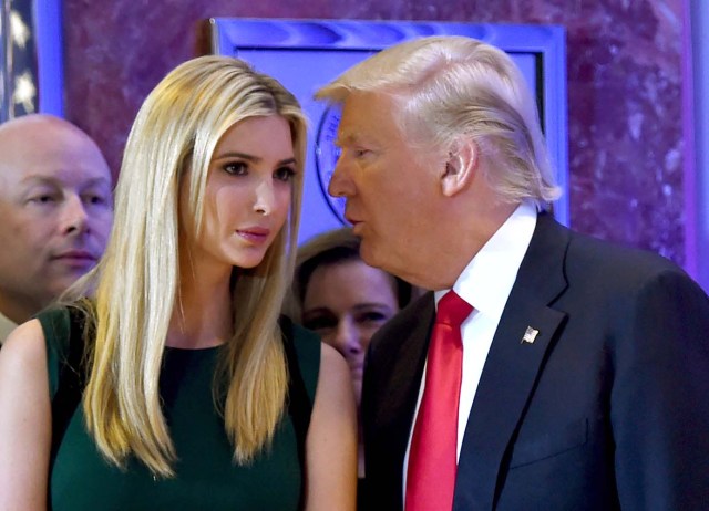 (FILES) This file photo taken on January 11, 2017 shows US President-elect Donald Trump talking to his daughter Ivanka during a press conference at Trump Tower in New York. In his January inauguration speech, US President Donald Trump made a seemingly straightforward pledge: "We will follow two simple rules: buy American and hire American." His daughter is the exception: even as he spoke, at least eight shipments of Ivanka Trump-branded shoes, bags and clothes -- more than 53.5 tonnes -- were steaming towards American ports from China, according to US Customs bills of lading examined by AFP. / AFP PHOTO / Timothy A. CLARY / TO GO WITH China-US-politics-economy-trade-Trump, FOCUS by Ben DOOLEY