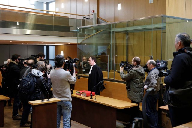 Francis Vuillemin, lawyer of Ilich Ramirez Sanchez, known as Carlos the Jackal, is surrounded by journalists in the courtroom before the opening of Carlos' trial in Paris, France March 13, 2017. Carlos the Jackal is appearing in a Paris court for a deadly 1974 attack at a shopping arcade in the French capital, a trial that victims’ families have been awaiting for decades. REUTERS/Benoit Tessier