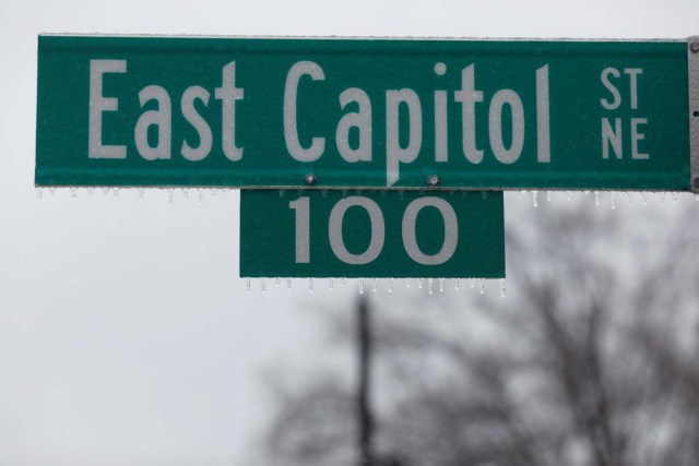 Icicles are seen on a street sign outside the Capitol Building in Washington, D.C., U.S. March 14, 2017. REUTERS/Aaron P. Bernstein