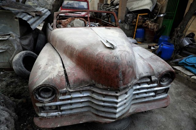 A picture taken on March 9, 2017, shows a 1947 Cadillac parked in the garden of Mohammed Mohiedin Anis, or Abu Omar's home in Aleppo's formerly rebel-held al-Shaar neighbourhood.  / AFP PHOTO / JOSEPH EID