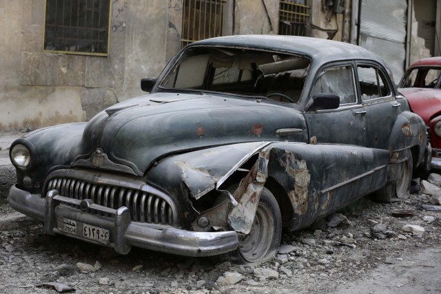 A picture taken on March 9, 2017, shows a 1948 Buick parked outside the home of Mohammed Mohiedin Anis, or Abu Omar, in Aleppo's formerly rebel-held al-Shaar neighbourhood.  / AFP PHOTO / JOSEPH EID