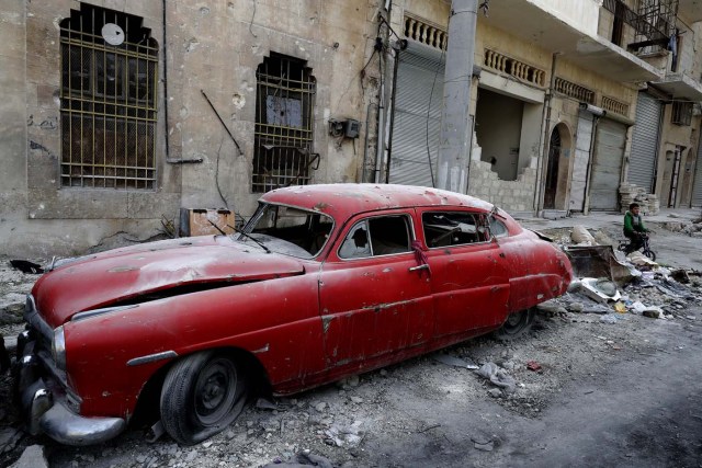 A picture taken on March 9, 2017, shows a 1949 Hudson Commodor parked outside the home of Mohammed Mohiedin Anis, or Abu Omar, in Aleppo's formerly rebel-held al-Shaar neighbourhood.  / AFP PHOTO / JOSEPH EID