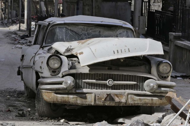 A picture taken on March 9, 2017, shows a 1955 Buick Super parked outside the home of Mohammed Mohiedin Anis, or Abu Omar, in Aleppo's formerly rebel-held al-Shaar neighbourhood.  / AFP PHOTO / JOSEPH EID