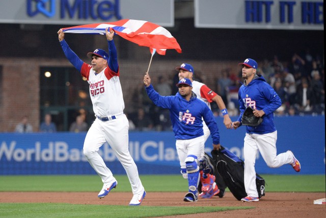 Mar 14, 2017; San Diego, CA, USA; The Puerto Rico bullpen runs onto the field after defeating the Dominican Republic during the 2017 World Baseball Classic at Petco Park. Puerto Rico won 3-1. Mandatory Credit: Orlando Ramirez-USA TODAY Sports