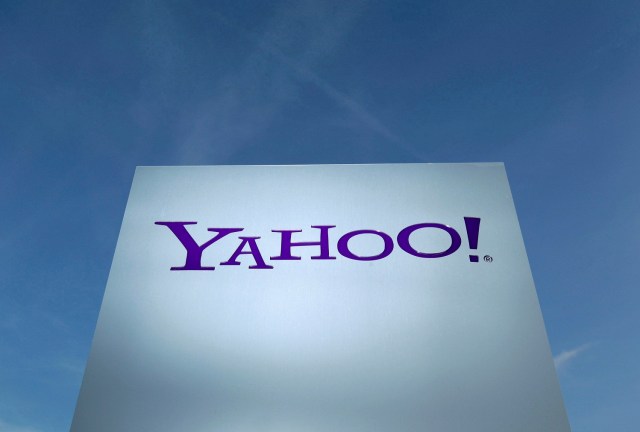 FILE PHOTO - A Yahoo logo is pictured in front of a building in Rolle, Switzerland on December 12, 2012. REUTERS/Denis Balibouse/File Photo