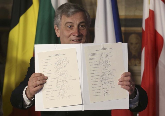 European Parliament President Antonio Tajani holds up a document signed by EU leaders during their meeting on the 60th anniversary of the Treaty of Rome, in Rome, Italy March 25, 2017. REUTERS/Remo Casilli