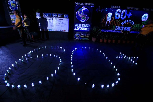 Glasses with lights lamps form the number 60, representing the 60 minutes of Earth Hour, during Earth Hour in Makati city, metro Manila, Philippines March 25, 2017. REUTERS/Romeo Ranoco
