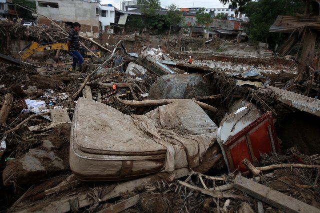 A man looks at a destroyed area, after flooding and mudslides caused by heavy rains leading several rivers to overflow, pushing sediment and rocks into buildings and roads, in Mocoa, Colombia April 2, 2017. Picture taken April 2, 2017. REUTERS/Jaime Saldarriaga