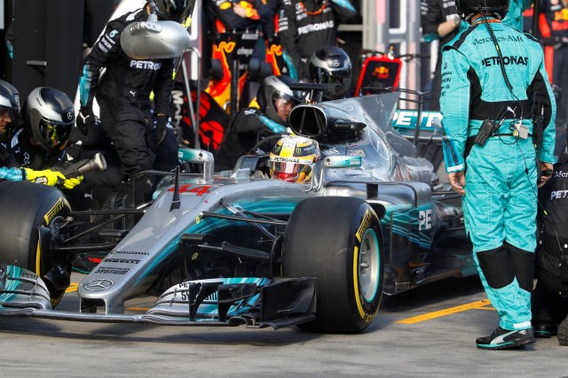 Formula One - F1 - Australian Grand Prix - Melbourne, Australia - 26/03/2017 Mercedes driver Lewis Hamilton of Britain has a tyre change during the Australian Formula One Grand Prix. REUTERS/Brandon Malone