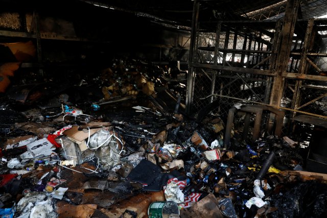 Burned debris are seen in a warehouse in the building where the offices of Venezuelan opposition leader and Governor of Miranda state Henrique Capriles are located, in Caracas, Venezuela, April 8, 2017. REUTERS/Carlos Garcia Rawlins