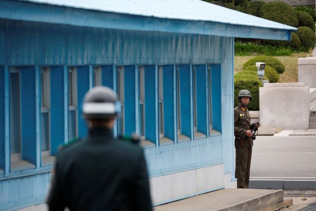 A North Korean soldier keeps watch toward the south as U.S. Vice President Mike Pence (not pictured) arrives at the truce village of Panmunjom, South Korea, April 17, 2017.  REUTERS/Kim Hong-Ji
