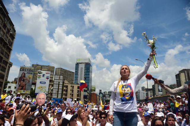 The wife of imprisoned opposition leader Leopoldo Lopez, Lilian Tintori, takes part in a women's march aimed to keep pressure on President Nicolas Maduro, whose authority is being increasingly challenged by protests and deadly unrest, in Caracas on May 6, 2017. The death toll since April, when the protests intensified after Maduro's administration and the courts stepped up efforts to undermine the opposition, is at least 36 according to prosecutors. / AFP PHOTO / RONALDO SCHEMIDT