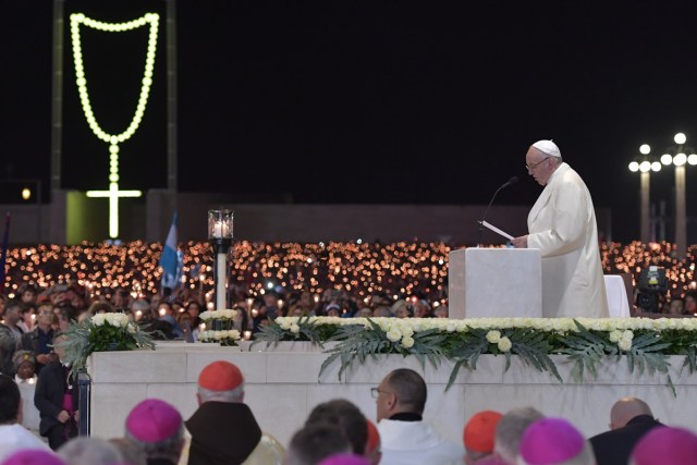 Pope Francis speaks during the Blessing for the Candles from the Chapel of the Apparitions, in Fatima on May 12, 2017. Two of the three child shepherds who reported apparitions of the Virgin Mary in Fatima, Portugal, one century ago, will be declared saints on May 13, 2017 by Pope Francis. The canonisation of Jacinta and Francisco Marto will take place during the Argentinian pontiff's visit to a Catholic shrine visited by millions of pilgrims every year. / AFP PHOTO / Tiziana FABI