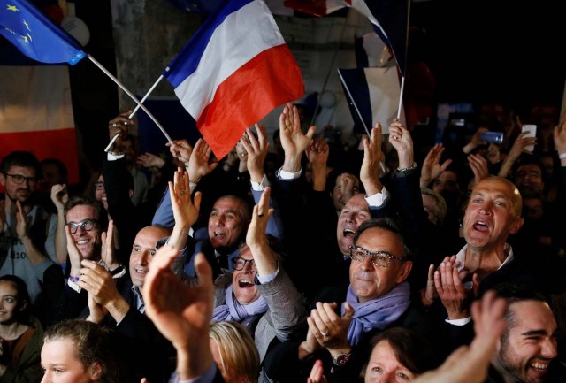 Supporters of Emmanuel Macron celebrate after the second round of 2017 French presidential election, in Lyon, France, May 7, 2017. REUTERS/Robert Pratta