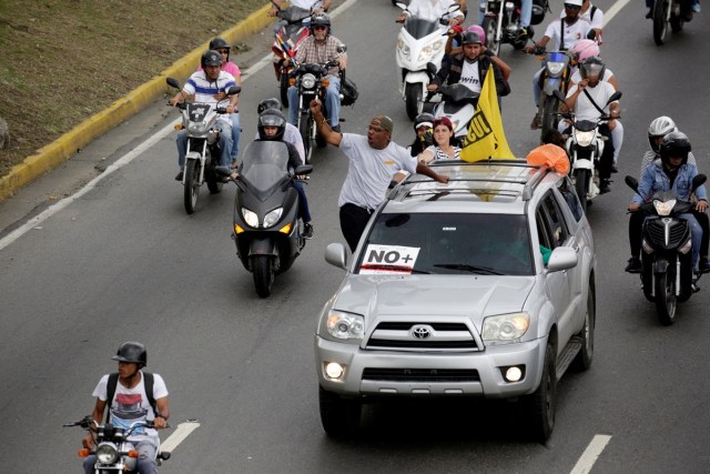 Demonstrators riding motorcycles and driving cars take part in a nationwide protest against President Nicolas Maduro government, in Caracas, Venezuela, May 13, 2017. REUTERS/Marco Bello