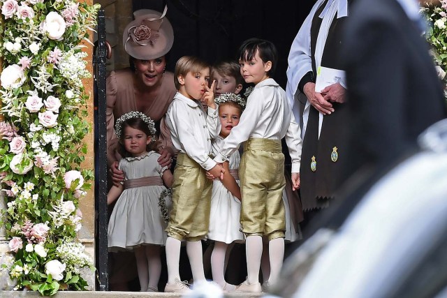 Britain's Catherine, Duchess of Cambridge (L), stands with her daughter Princess Charlotte, (BOTTOM L), as they arrive for the wedding of Pippa Middleton and James Matthews at St Mark's Church in Englefield, west of London, on May 20, 2017. REUTERS/Justin Tallis/Pool
