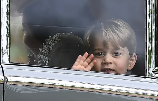 Britain's Prince George waves as he leaves in a car after attending the wedding of his aunt, Pippa Middleton, to James Matthews at St Mark's Church in Englefield, Britain May 20, 2017. Pippa Middleton is the sister of Catherine, Duchess of Cambridge.  REUTERS/Justin Tallis/Pool