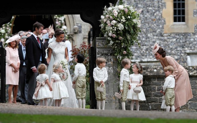 Britain's Catherine, Duchess of Cambridge stands with her son Prince George as she looks across at Pippa Middleton and James Matthews after their wedding at St Mark's Church in Englefield, Britain on May 20, 2017.    REUTERS/Kirsty Wigglesworth/Pool