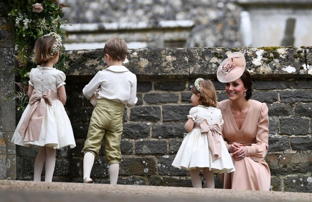 Britain's Catherine, Duchess of Cambridge stands with her daughter Princess Charlotte, a bridesmaid, following the wedding of her sister Pippa Middleton to James Matthews at St Mark's Church in Englefield, Britain on May 20, 2017.    REUTERS/Justin Tallis/Pool