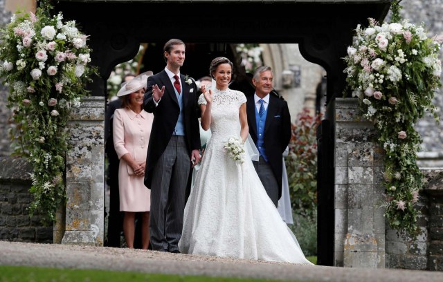 Pippa Middleton and James Matthews pose for photographs after their wedding at St Mark's Church in Englefield, west of London, on May 20, 2017. REUTERS/Kirsty Wigglesworth/Pool