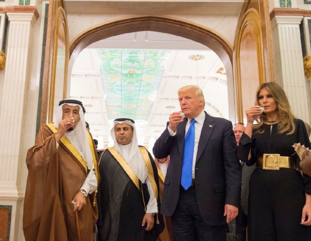 Saudi Arabia's King Salman bin Abdulaziz Al Saud (L), U.S. President Donald Trump and first lady Melania Trump drink ceremonial coffee at the Royal Court in Riyadh, Saudi Arabia May 20, 2017. Saudi Press Agency/Handout via REUTERS ATTENTION EDITORS - THIS PICTURE WAS PROVIDED BY A THIRD PARTY. FOR EDITORIAL USE ONLY. NO RESALES. NO ARCHIVE. TPX IMAGES OF THE DAY
