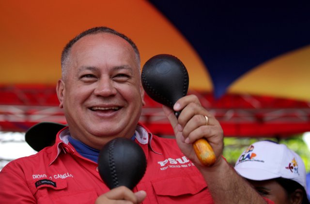 Deputy of Venezuela's United Socialist Party Diosdado Cabello plays the maracas during a rally of supporters of Venezuela's President Nicolas Maduro in support of the National Constituent Assembly in Caracas,Venezuela May 31, 2017. REUTERS/Marco Bello