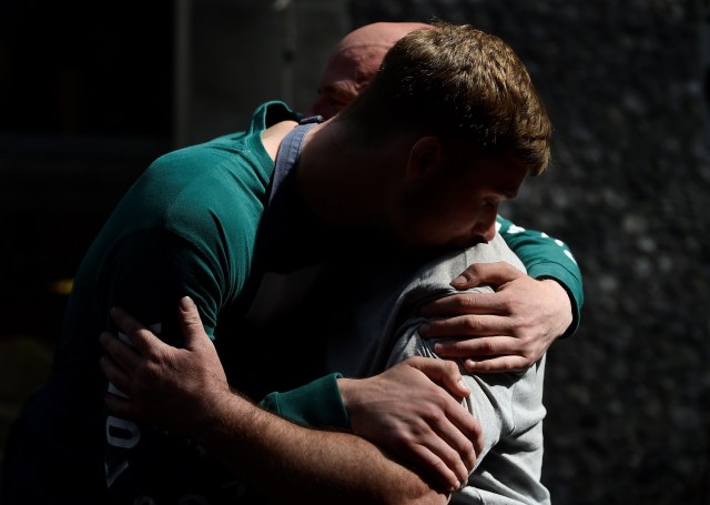 People embrace in Borough Market, which officially re-opened today following the recent attack, in central London, Britain June 14, 2017. REUTERS/Hannah McKay