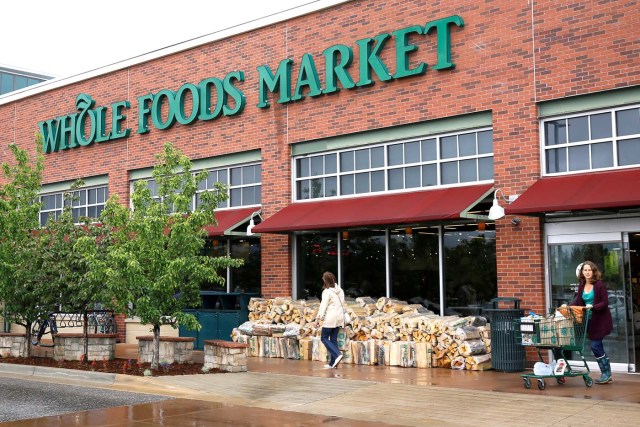 FILE PHOTO - Customers leave the Whole Foods Market in Boulder, Colorado, U.S. on May 10, 2017. REUTERS/Rick Wilking/File Photo