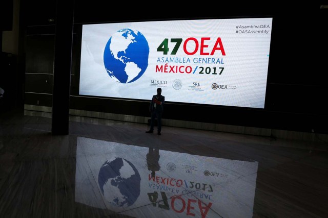 A screen with the logo of The Organization of American States is pictured where the where the 47th General Assembly will take place in Cancun, Mexico June 18, 2017. REUTERS/Carlos Jasso