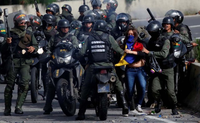 A demonstrator is detained by security forces during clashes at a protest against Venezuelan President Nicolas Maduro's government in Caracas, Venezuela, July 10, 2017. REUTERS/Carlos Garcia Rawlins