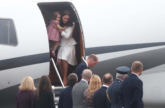 Prince William, the Duke of Cambridge, his wife Catherine, The Duchess of Cambridge and Princess Charlotte arrive at a military airport in Warsaw, Poland July 17, 2017. REUTERS/Kacper Pempel