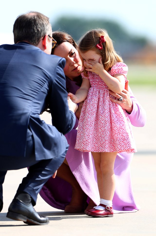 Princess Kate, the Duchess of Cambridge and Princess Charlotte before boarding their plane in Hamburg Finkenwerder, Germany, July 21, 2017. REUTERS/Daniel Bockwoldt/POOL