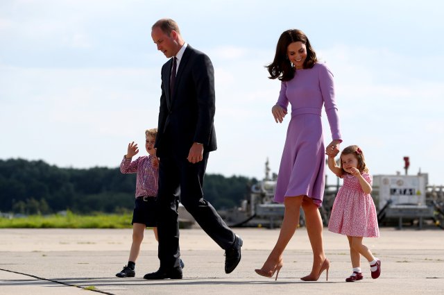 Britain's Prince William, the Duke of Cambridge, his wife Princess Kate, the Duchess of Cambridge, Prince George and Princess Charlotte walk at the airfield in Hamburg Finkenwerder, Germany, July 21, 2017. REUTERS/Christian Charisius/POOL